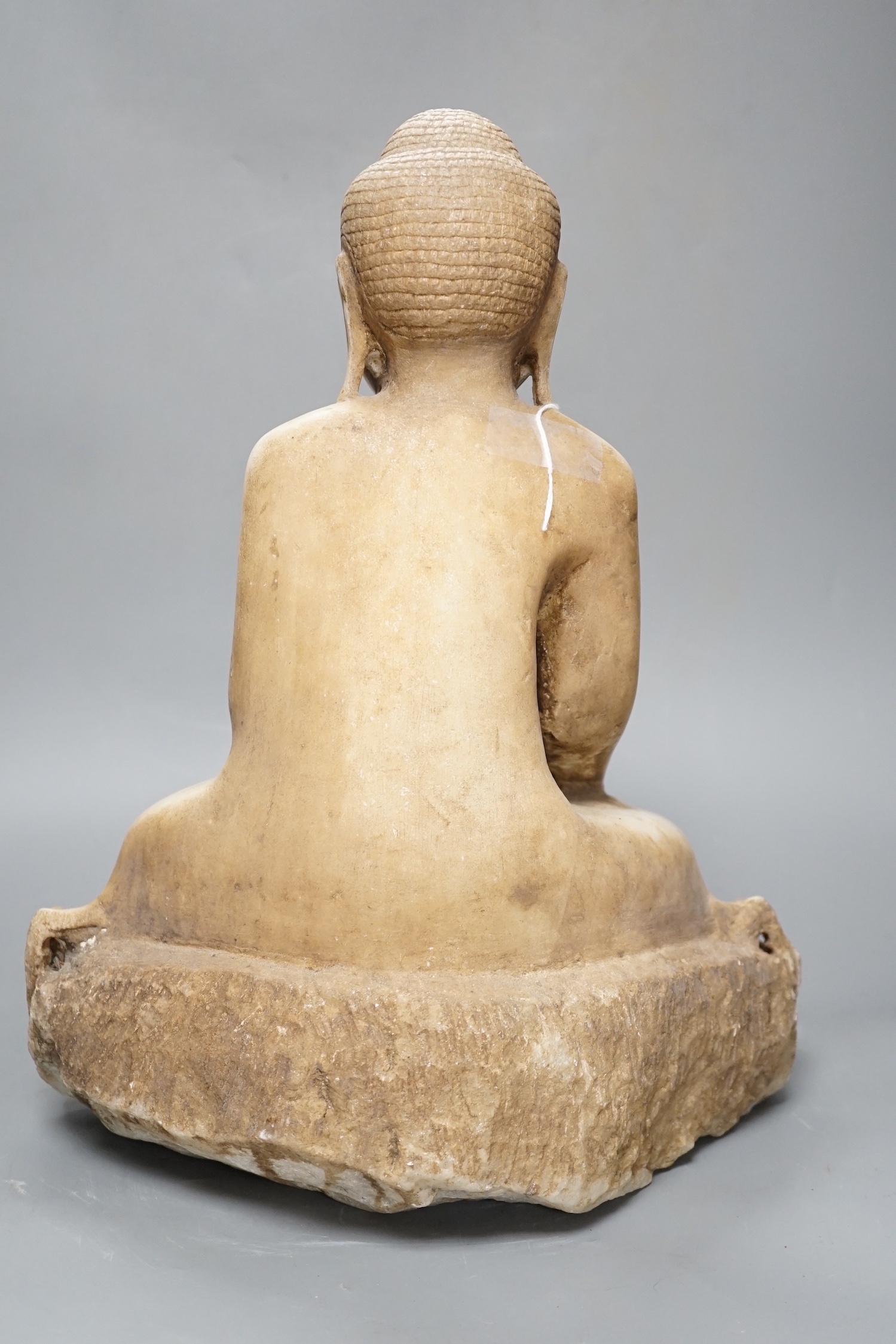 A Burmese carved marble seated Buddha on lotus throne, 20th century - 39cm high